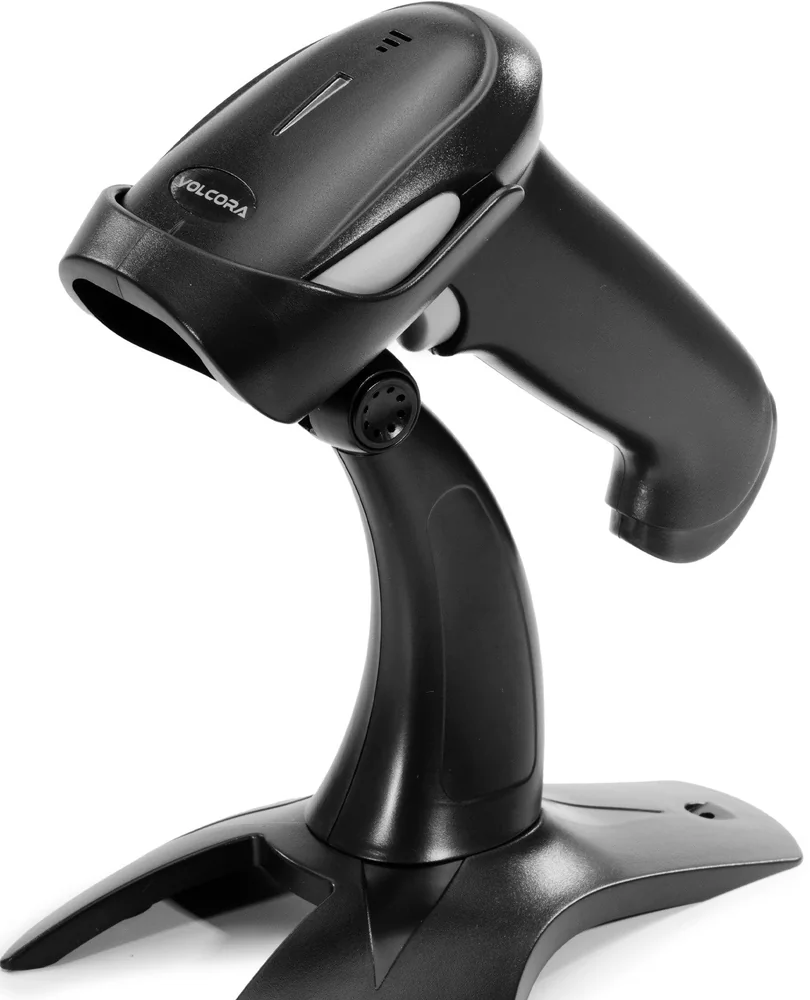 A handheld barcode scanner standing in its base